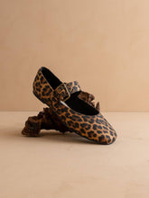 Load image into Gallery viewer, Leopard print shoe with decorative buckle on a beige background
