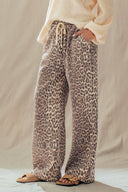 Animal leopard print elastic waist pockets wide leg relaxed jeans pants shop fond du lac women’s clothing store 