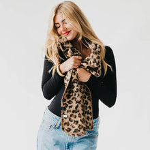 Load image into Gallery viewer, Woman wearing a leopard print scarf with a plain background
